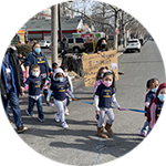 Children from Lulac walking with masks on